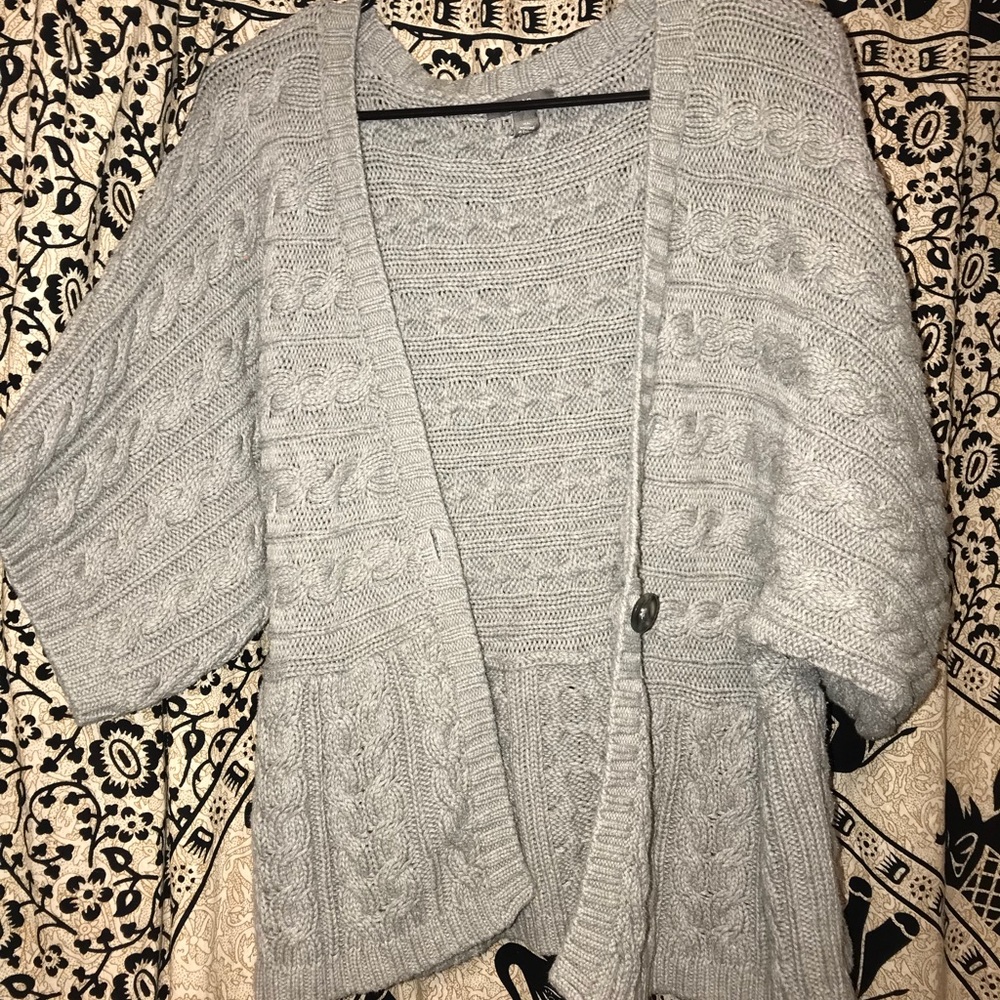 Grey knitted cardigan.
